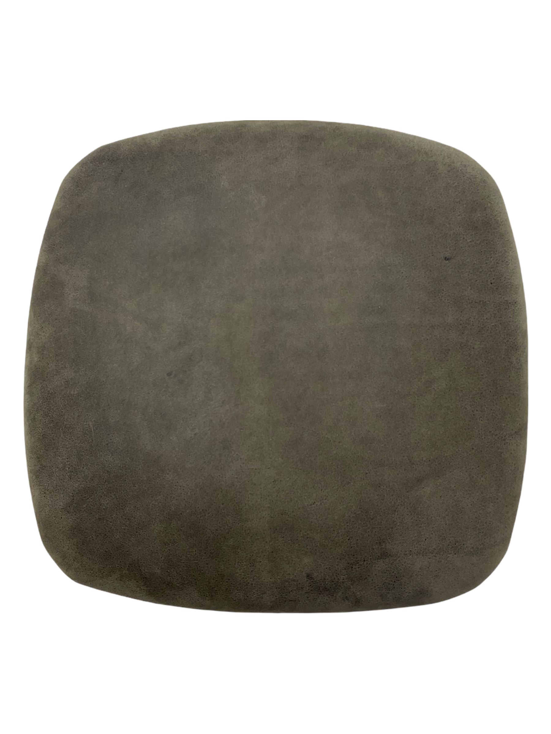 John Sankey - low armchair, buttoned back upholstered in tartan patterned fabric with contrasting grey leather, raised on turned and ebonised front feet with brass and ceramic castors, with matching foot stool