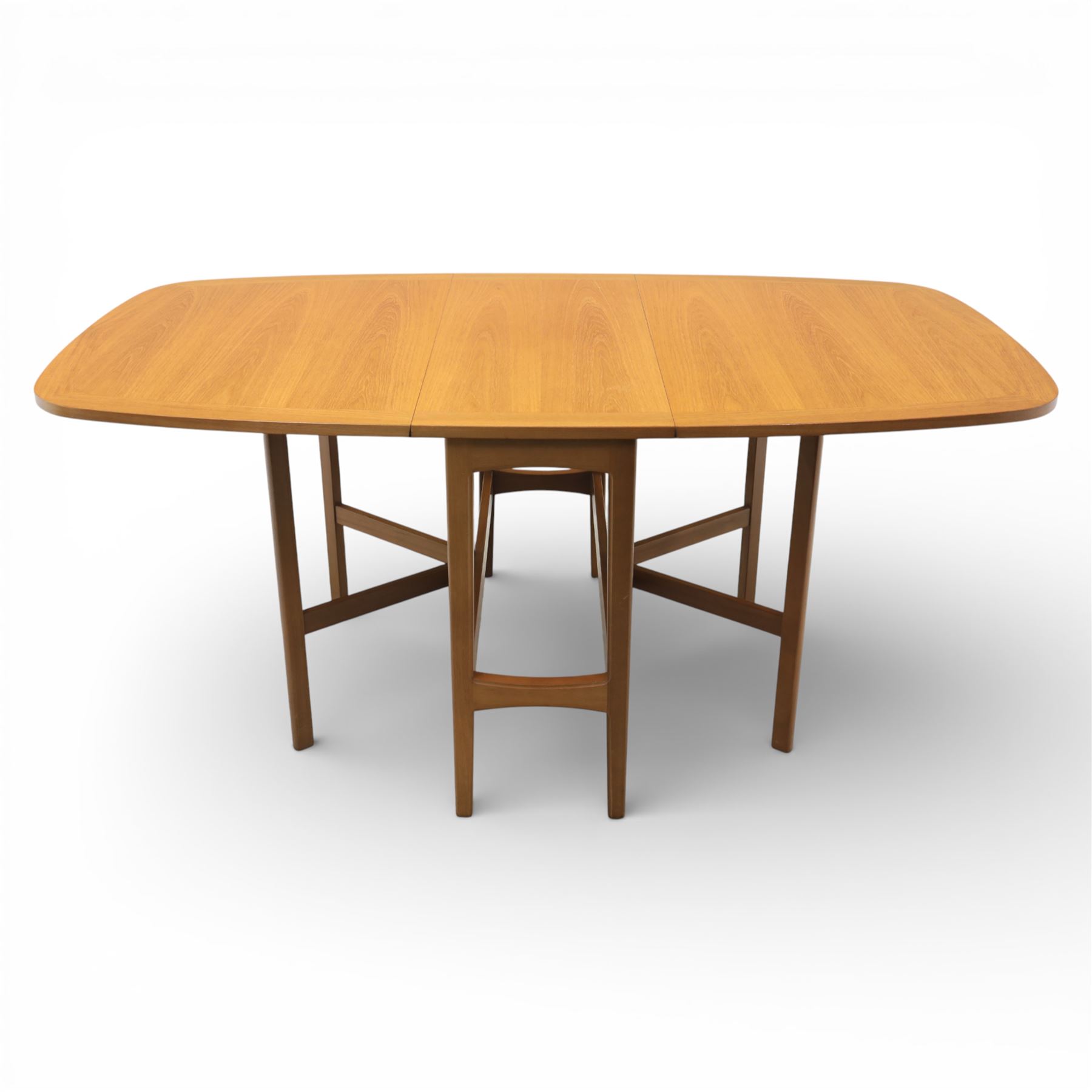 Nathan - teak drop leaf dining table, the rectangular top with rounded corners fitted with twin hinged drop leaves and gate legs, extended to form an oval table 174cm in length, raised on square section supports united by stretchers