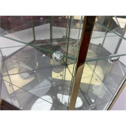 Swarovski Crystal Masquerade trilogy; 1999 Masquerade Pierrot, 2000 Columbine, 2001 Harlequin all with accompanying plaque, stand and original box, together with a glass display case with mirrored back and sides 