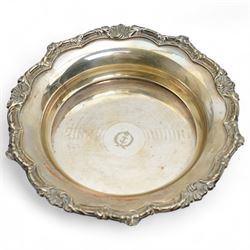 Early 19th century silver punch ladle, the bowl inset with a George III coin and with twisted whale bone handle,, plated wine funnel, two knives by John Wigfall, Sheffield with mammoth tooth handles, plated coaster with engraved crowned anchor crest, teapot stand with brass centre and plated surround and a pair of sugar tongs  