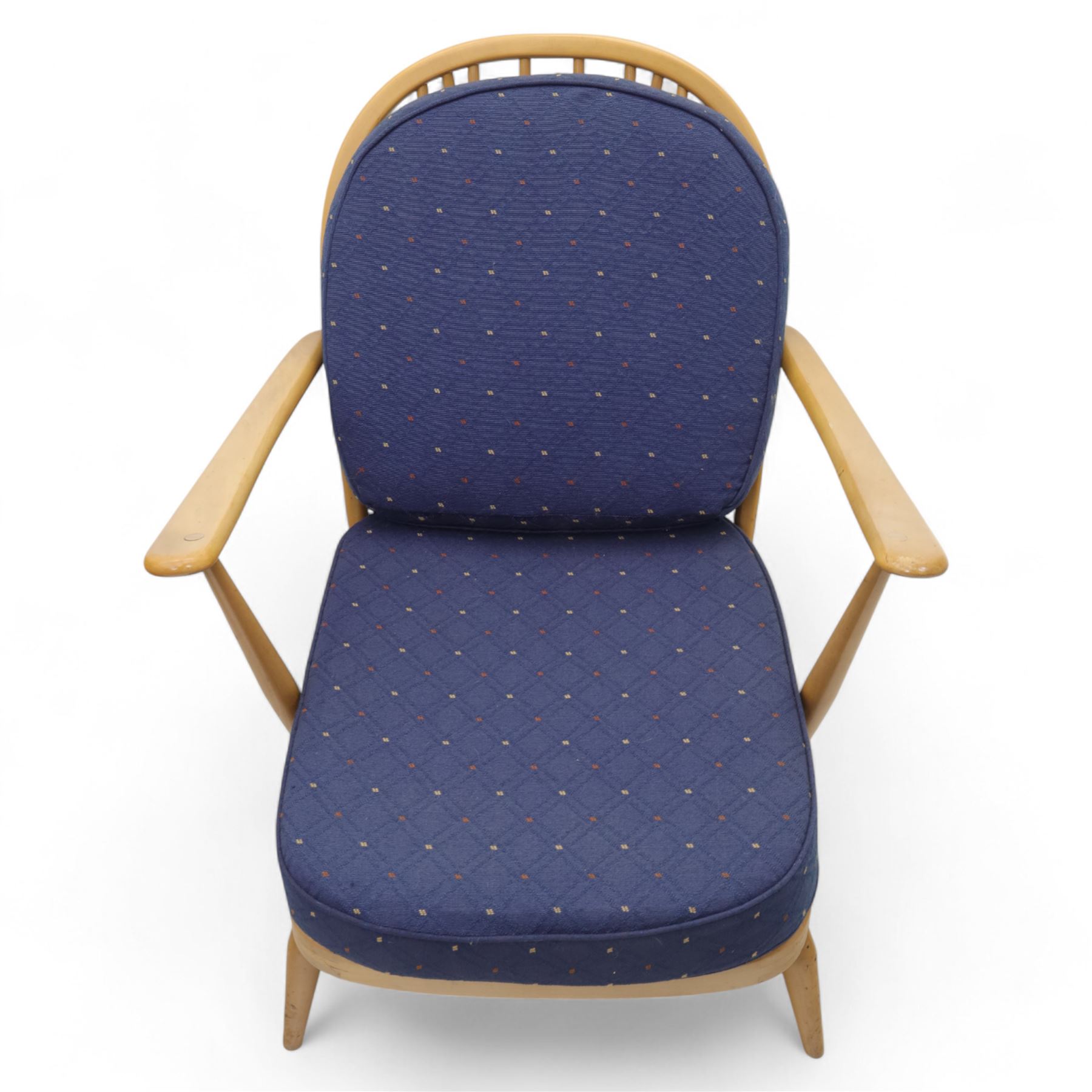 Ercol - Model '203', pair of easy chairs, with blue upholstered cushions and additional orange covers, with looped backrest and shaped spindles, outward swept arms, drop in seat frame