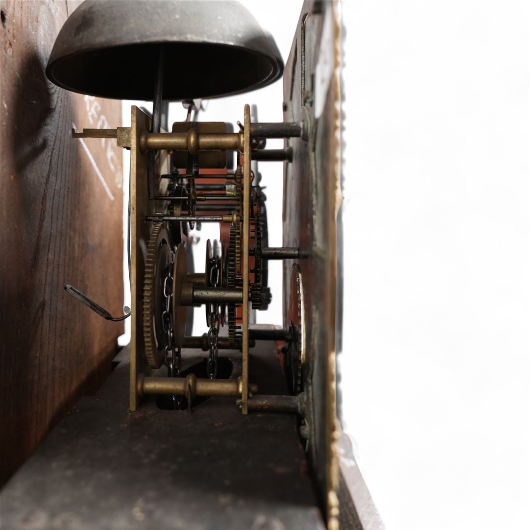 Cooper of Derby - Early 18th century 30hr oak longcase clock c1740, with a flat topped hood and plain frieze beneath, square hood door flanked by turned pilasters with wooden capitals, long trunk door with a wavy top on a square plinth with applied skirting, brass dial with cast spandrels and an engraved dial centre, chapter with Roman numerals, quarter hour markers, single steel hand and date aperture, chain driven countwheel striking movement, sounding the hours on a bell. With weight and pendulum.