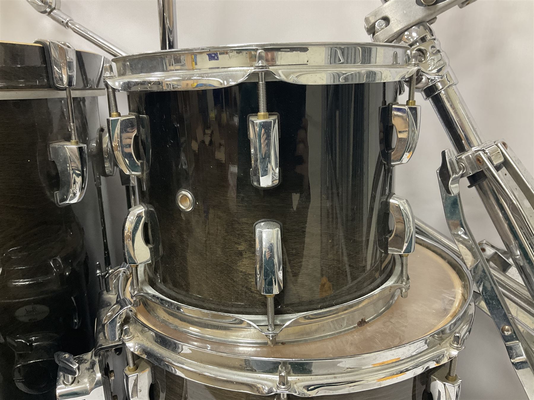 Pearl Vision SST Birch Ply shell four-piece drum kit in black comprising bass drum with foot pedal and three graduated toms; together with Pearl Custom Alloy Sensitone steel snare drum, drum and cymbal stands, microphone stand, stool and various drum sticks 