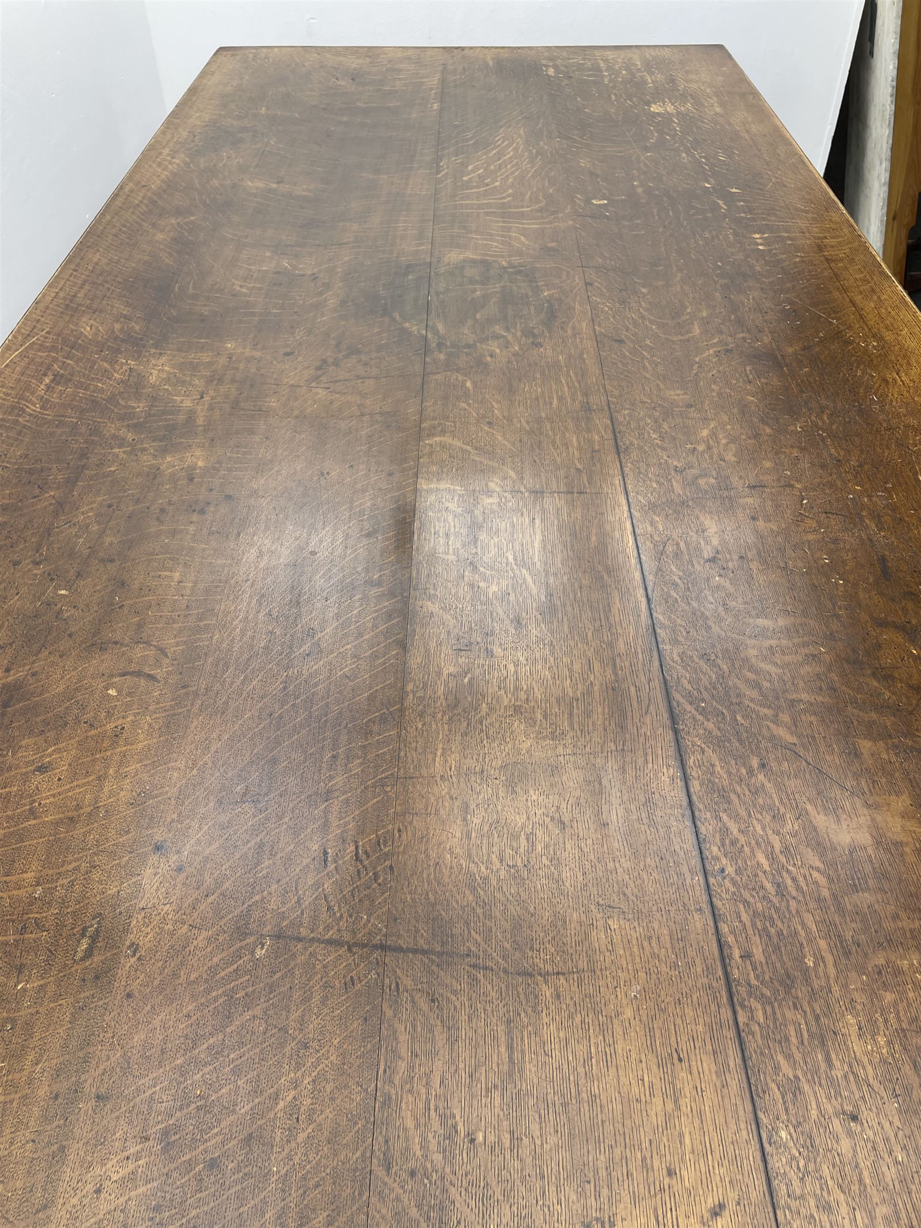 Large early 20th century oak boardroom table, rectangular moulded top on six turned and faceted supports 