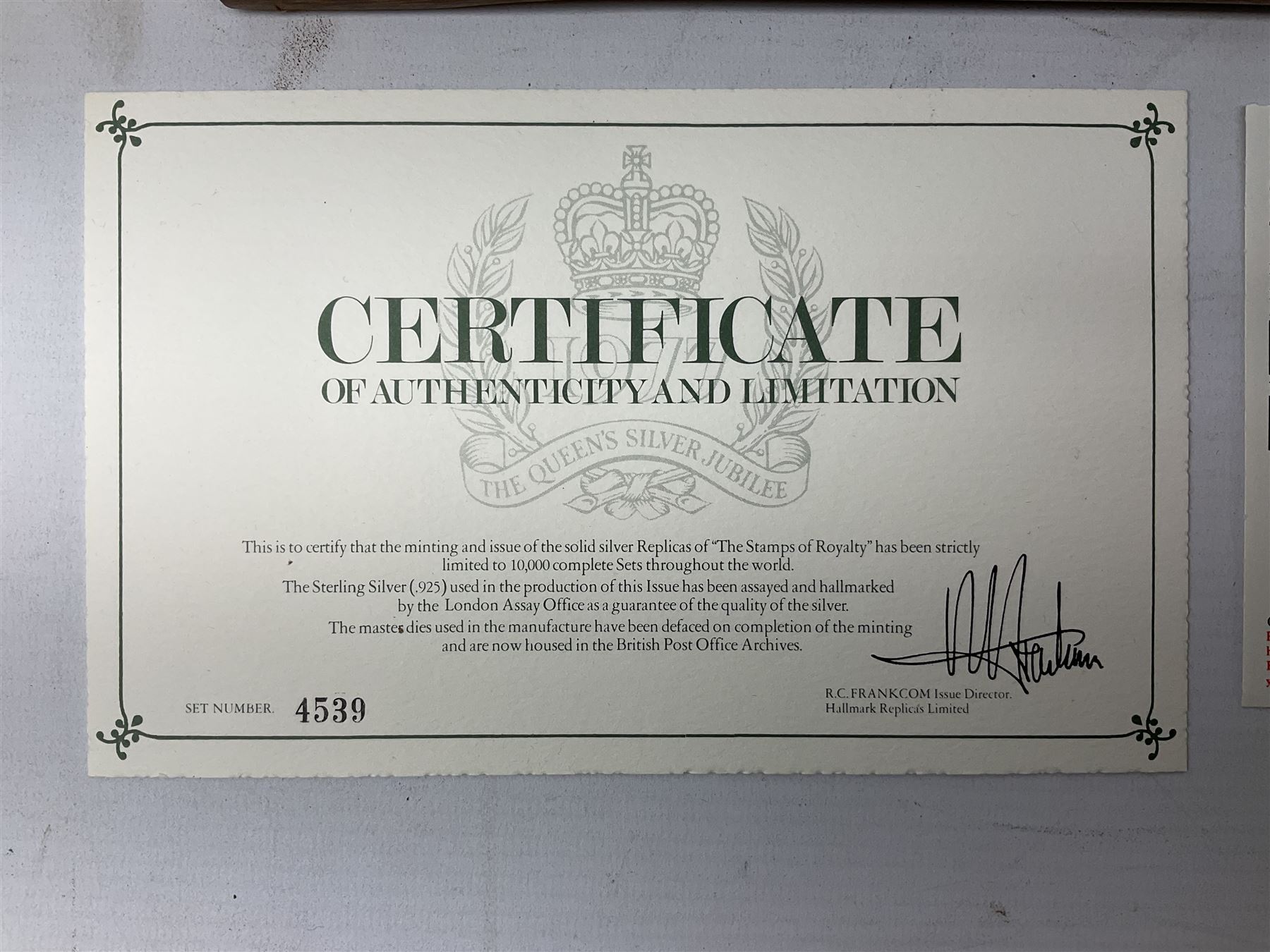 The Stamps of Royalty collection consisting of twenty-five sterling silver hallmarked stamp replicas, housed in a fitted wooden display case, with certificates, polishing cloth and certificates