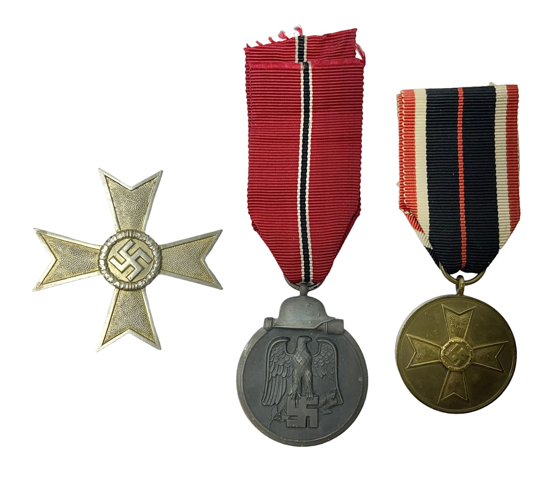German War Merit Cross 1st Class, the pin-back stamped '50'; War Merit Medal; and Ostfront Medal for the Winter Campaign in Russia of 1941-1942 'Die Medaille Winterschlacht Im Osten'; all with ribbons (3)