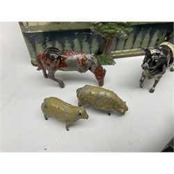 Chad Valley clockwork Fordson Major Tractor, a group of play worn Britains and other lead and metal farm animals, figures and accessories including a kennel, haystacks, dovecote, cows, sheep etc, together with a diecast model of a Tandem Bike L31cm