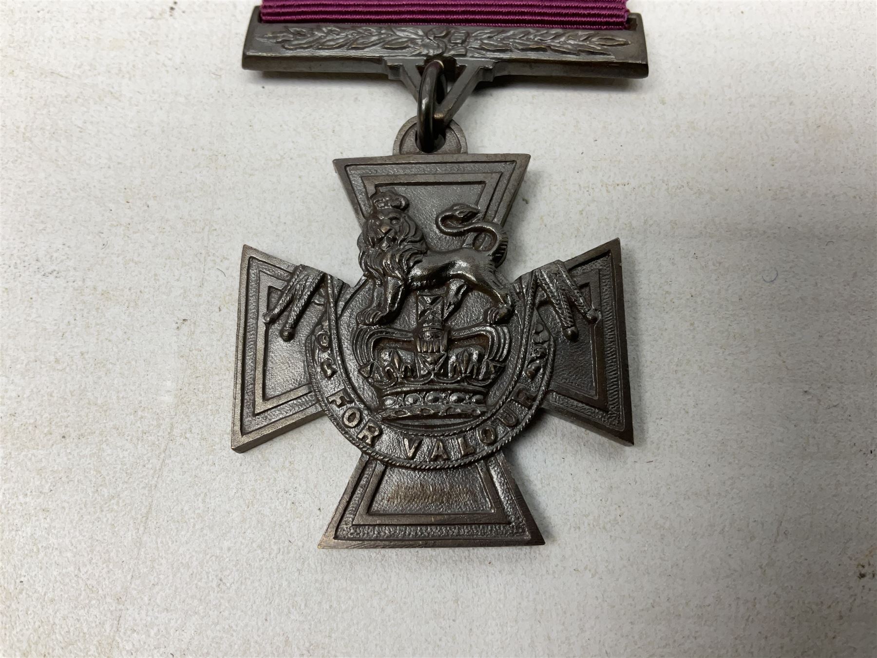 Victoria Cross, an official Hancocks & Co, London replica, the reverse engraved ‘Hancocks 70’, in fitted leather case of issue; Auctioneer's Note: The Victoria Cross was instituted on 29th January 1856, with the first awards backdated to 1854, and in the first 150 years of its existence was awarded on 1,355 occasions (1,352 Crosses and 3 Second Award Bars). To mark the 150th Anniversary, the London jewellers Hancocks, who have manufactured every Victoria Cross ever awarded, issued a limited edition replica, the replicas all individually numbered on the reverse, with the edition limited to 1,352 replica crosses.