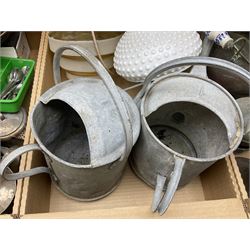 Three graduating copper coal buckets, two with blue and white porcelain handles, together with two metal watering cans, three blow torches, two large copper chargers, three hammers, copper warming pan, oil lamp and a collection of silver plate flatware, in three boxes 