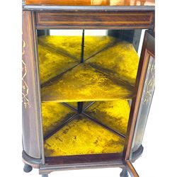 Late 19th century inlaid rosewood free standing corner display cabinet, the upper section featuring a mirrored panel above an inlaid cupboard with a felt-lined interior, complemented by a recessed open compartment with a mirrored back, the base with a glazed door enclosing two felt-lined shelves, on turned supports