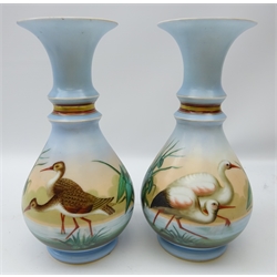  Pair Victorian opaque glass vases, baluster form with flared neck painted with Storks and Long-billed dowitcher wading in the water, H33cm  