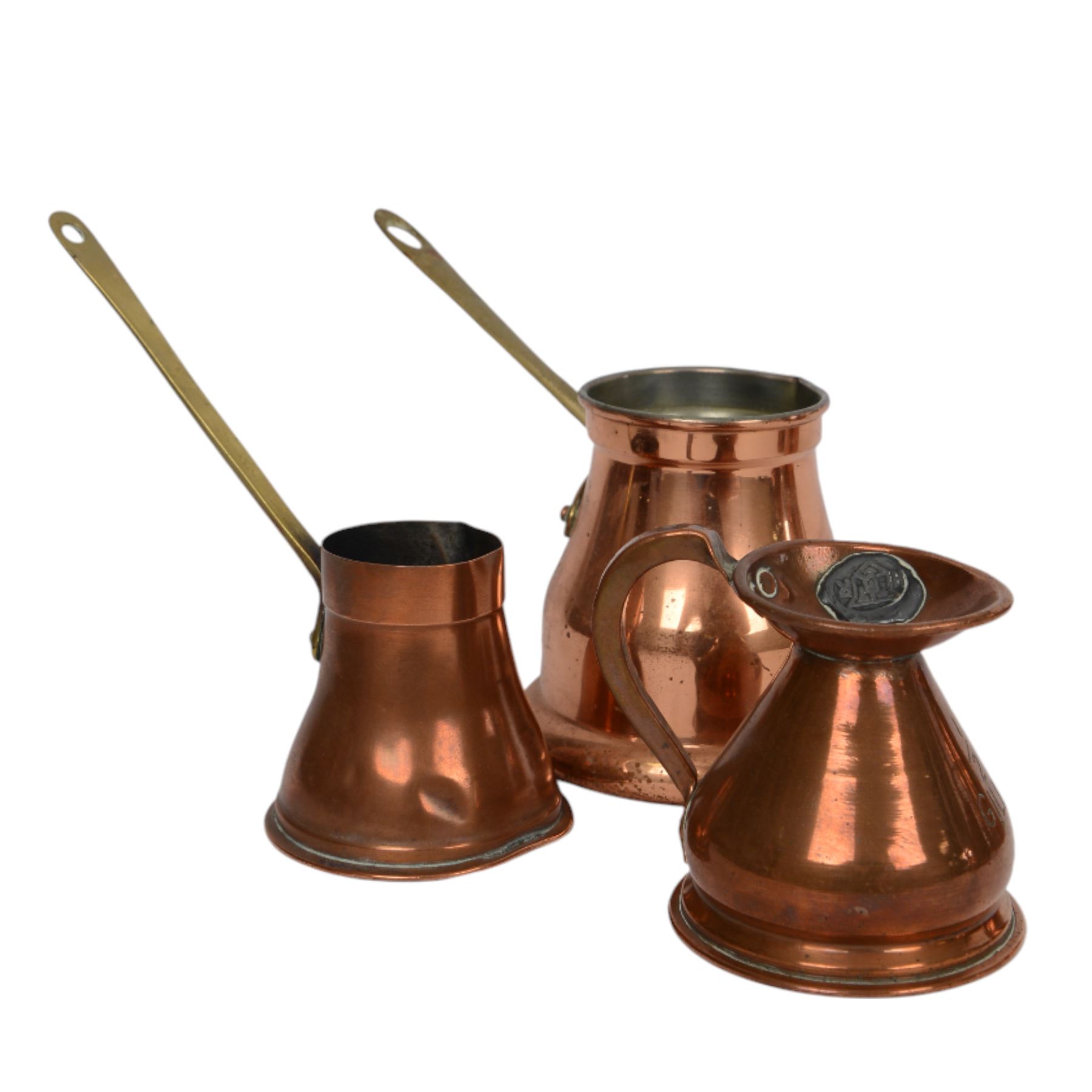 Copper and brass measures, including set of three copper jugs, set of four graduating brass pans and two sets of copper and brass cup measures