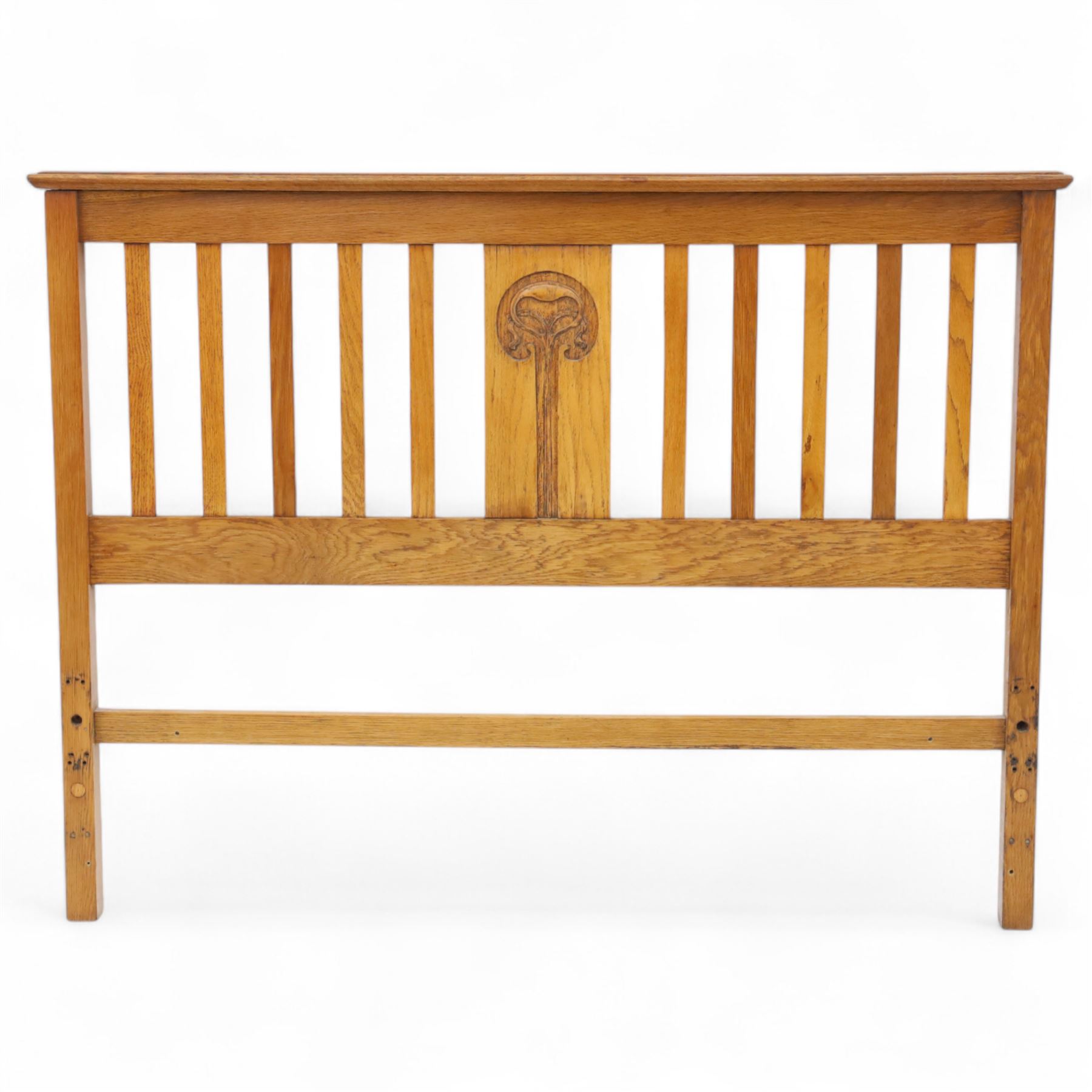 Art Nouveau oak double bed headboard, rectangular form with vertical slats centred by a carved stylised floral roundel