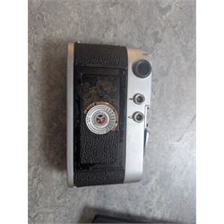 Leica DBP M3 35mm rangefinder camera body, serial no. 1038356, circa 1961, in chrome finish, housed in brown leather Leica case, with a Leitz Wetzlar Sunnilux 1:1.4/50 lens serial no. 1845148, Leitz Wetzlar Elmar 1:4/135 lens serial no. 1825980, 12575N hood, 12521G hood, Leica Meter MC serial no. 99015, Sunpak Auto28 SR Thyristor, Linhof 3 Way Pan tripod, and a Toshiba PE-1 Linear Exposure meter, all housed in an Original Benser Everready Case, most items with instruction booklets 