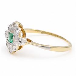 Early 20th century gold and platinum emerald and diamond panel ring, single rectangular cut emerald, surrounded by eight single cut diamonds, stamped 18ct & PT