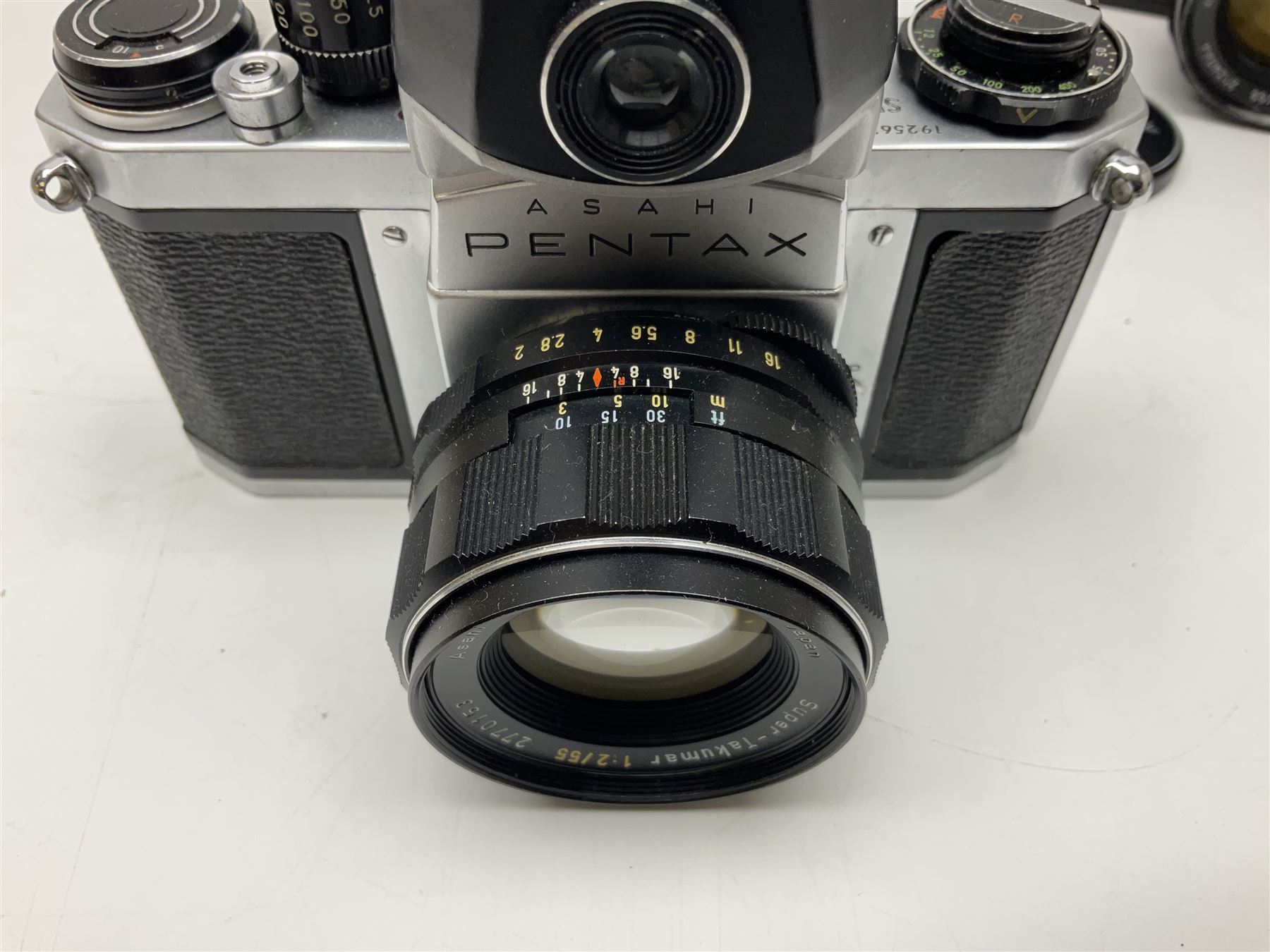 Asahi Pentax S1a camera body, serial no. 707071, with 'Super-Takumar 1:1.8/55' lens, serial no 2124044, together with Asahi Pentax Sv camera body, no. 1925617 with 'Super-Takumar 1:2/55' lens, serial no. 2770153, Asahi Pentax Meter, 'Super-Takumar 1:3.5/28' lens, serial no. 2075492 and 'Super-Takumar 1:4/150' lens, serial no. 1461613  