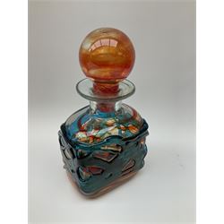 Mdina art glass decanter of red and orange glass with blue trellis work, with a glass ball stopper, signed beneath, together with two pink glass vases, a selection of carnival glass etc. 