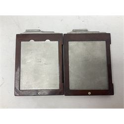 Folding plate camera in mahogany and lacquered brass, with Rapid Symmetrical Reetigmat len and two dark slides in canvas case