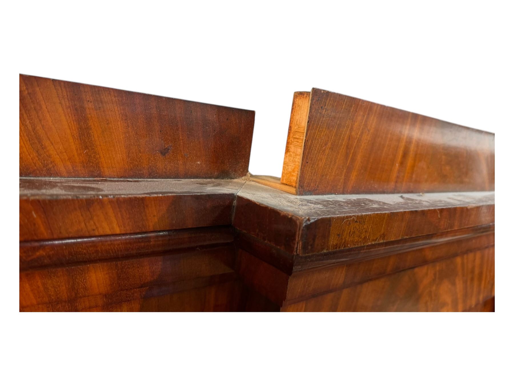 19th century mahogany break-fronted quadruple wardrobe, stepped and moulded projecting cornice over four arch panelled doors, moulded plinth base on blocks 