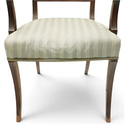 Georgian mahogany reeded carver armchair or elbow chair, bar back and scrolled arm terminals above over-stuffed seat, raised on sabre supports