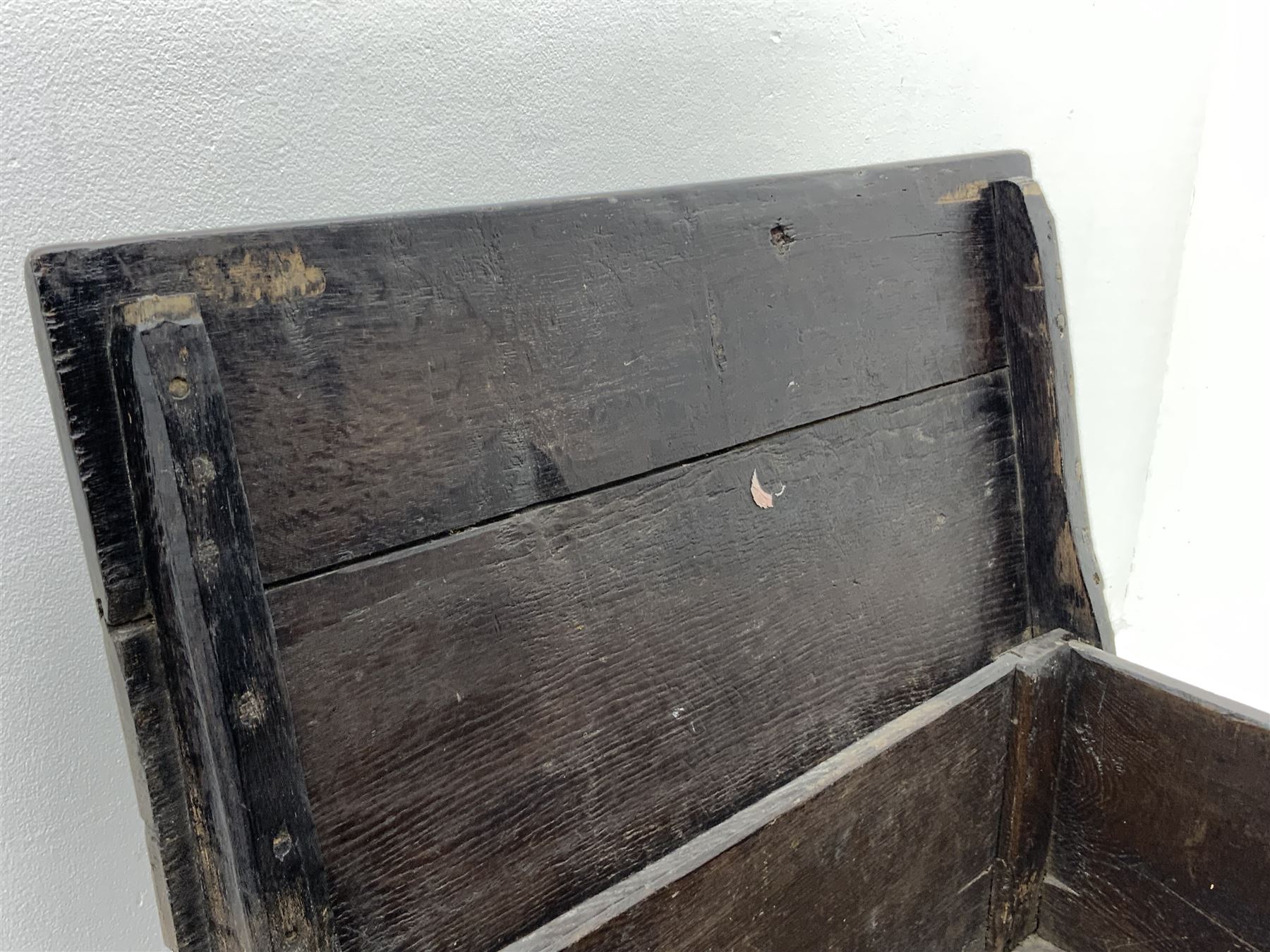 17th century vernacular oak boarded and joined clamp-front coffer or ark chest, enclosed by hinge lid, vertical stile supports