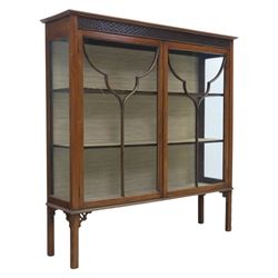 Edwardian mahogany display cabinet, blind-fretwork frieze over astragal glazed doors, squa...