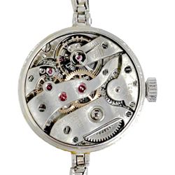 Audemars Piguet & Co Art Deco ladies platinum, diamond set manual wind wristwatch, movement No. 19931, cream / silvered dial with Arabic hour markers, the bezel milgrain set with round cut diamonds, to a platinum expanding bracelet
