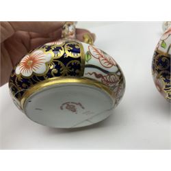 Pair of Royal Crown Derby 6299 imari pattern miniature vases, together with a miniature pitcher and dish in 2451 imari pattern, all with printed marks beneath, vase H12cm 