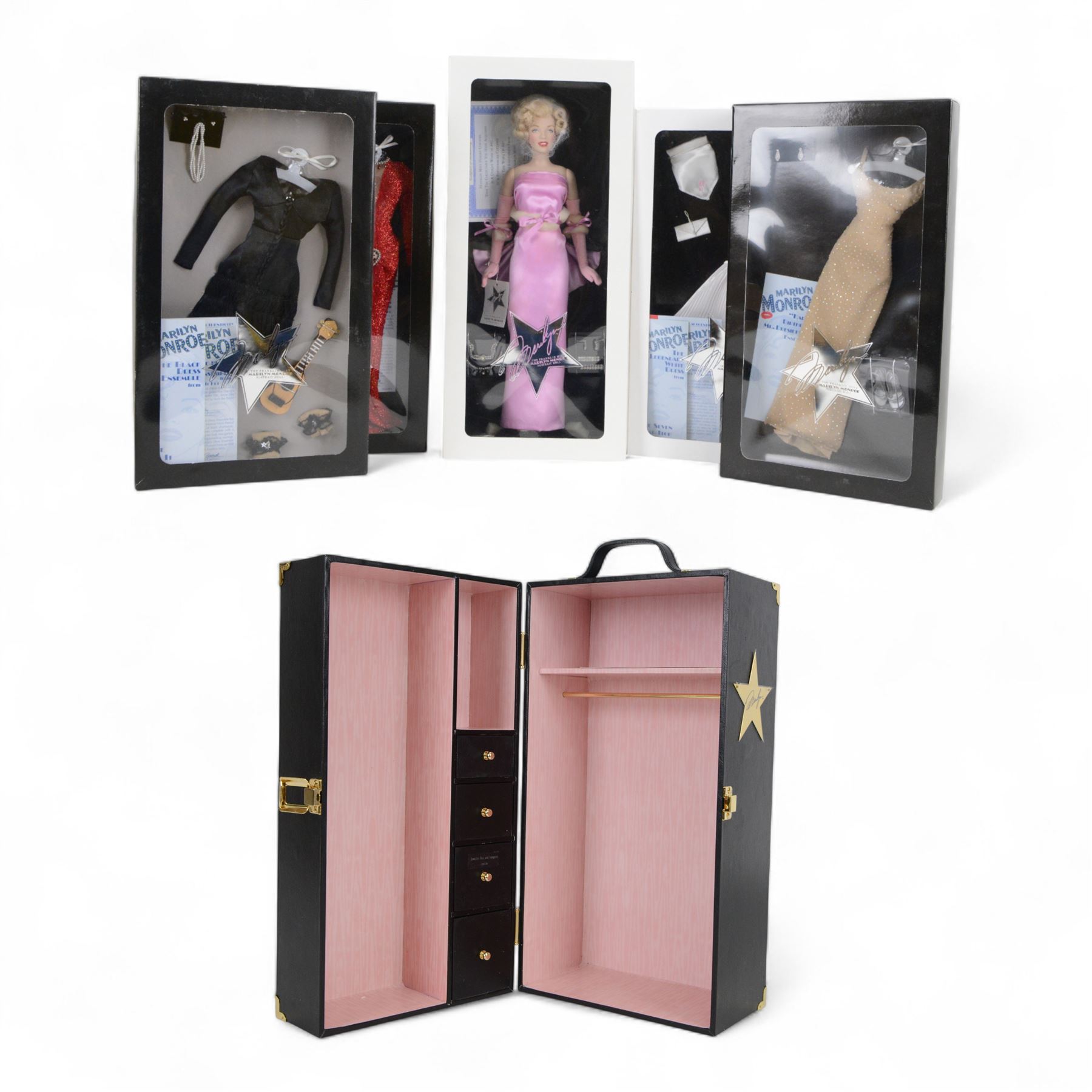 Franklin Mint Marilyn Monroe portrait doll, dressed in Gentleman Prefer Blondes pink dress, together with a wardrobe trunk and four outfits, comprising white dress from The Seven Year Itch, black dress from Some Like It Hot, red glitter dress with feather headress from The Seven Year Itch and the 'Happy Birthday Mr President' nude dress, all boxed with certificate of authenticity