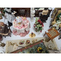 Dolls house living room and dining room furniture, including arm chairs, desk, fireplaces, dressers, tables, eight figures and a large collection of predominantly Christmas themed food, accessories and decorations