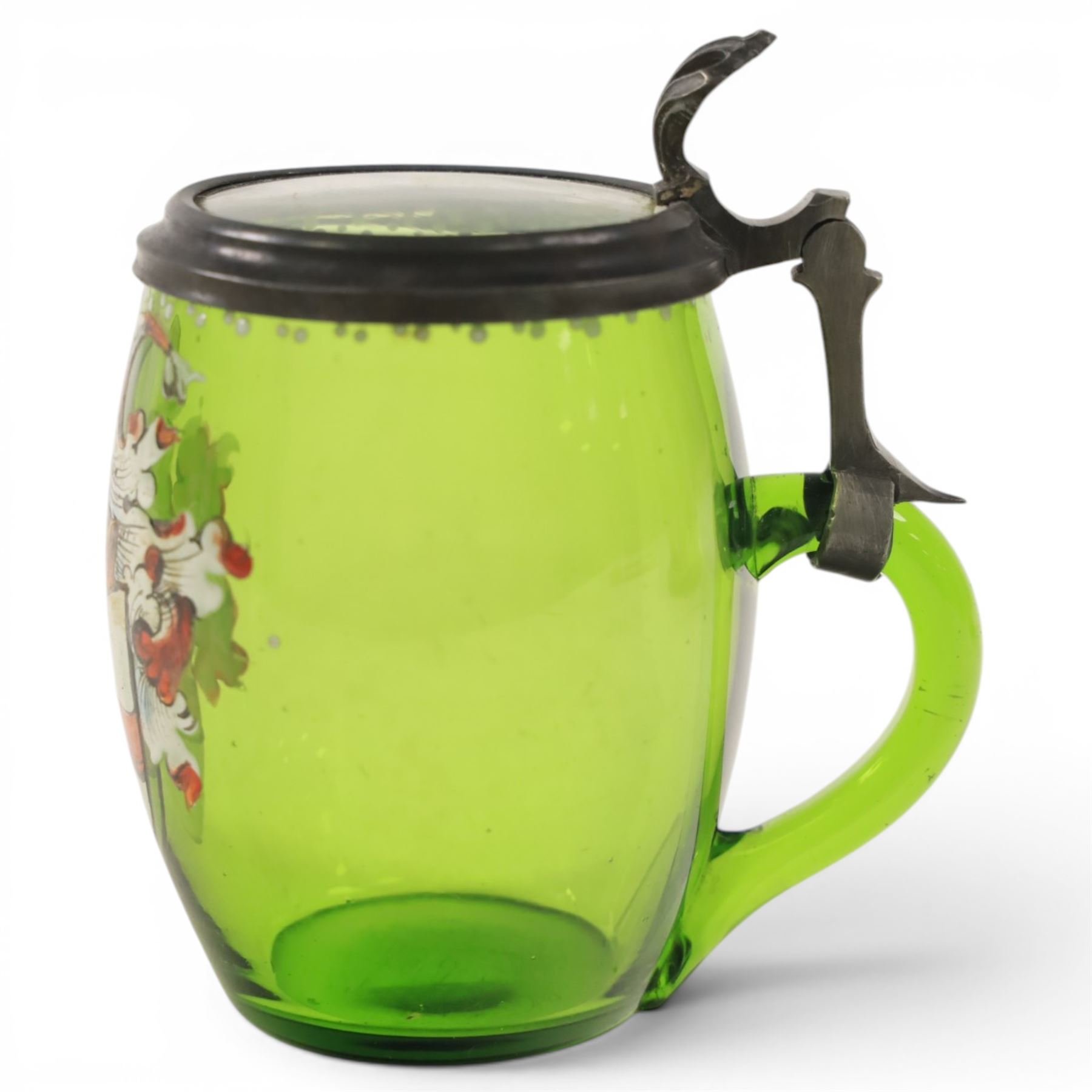 19th century German green glass stein, enamel decorated with a gentleman holding a stein, with a pewter lid, together with another smaller example decorated with a coat of arms 