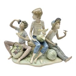 Lladro figure, Sweet Harvest, modelled as three young boys eating fruit, sculpted by Jose Roig, with original box, no 5380, year issued 1986, year retired 1989, H22cm