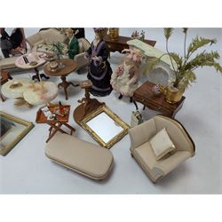 Dolls house furniture, including sofa, chairs, foot stools, fireplace, sideboards, five figures, mirrors, paintings and accessories