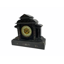 19th century Belgium slate mantle clock with an eight-day French rack striking movement striking the hours and half-hours on a coiled gong, dial with an enamel chapter ring and a gilt recessed centre, hours in upright Arabic numerals and minute markers, with steel Fleur de Lys hands, brass bezel and bevelled glass, case with recessed circular pillars in rouge marble and slate capitals, on a stepped bevelled plinth with matching marble inlay and incised carving, rectangular architectural plinth with carved quadrant supports, dial inscribed “Examd by T Hyde, Sleaford”