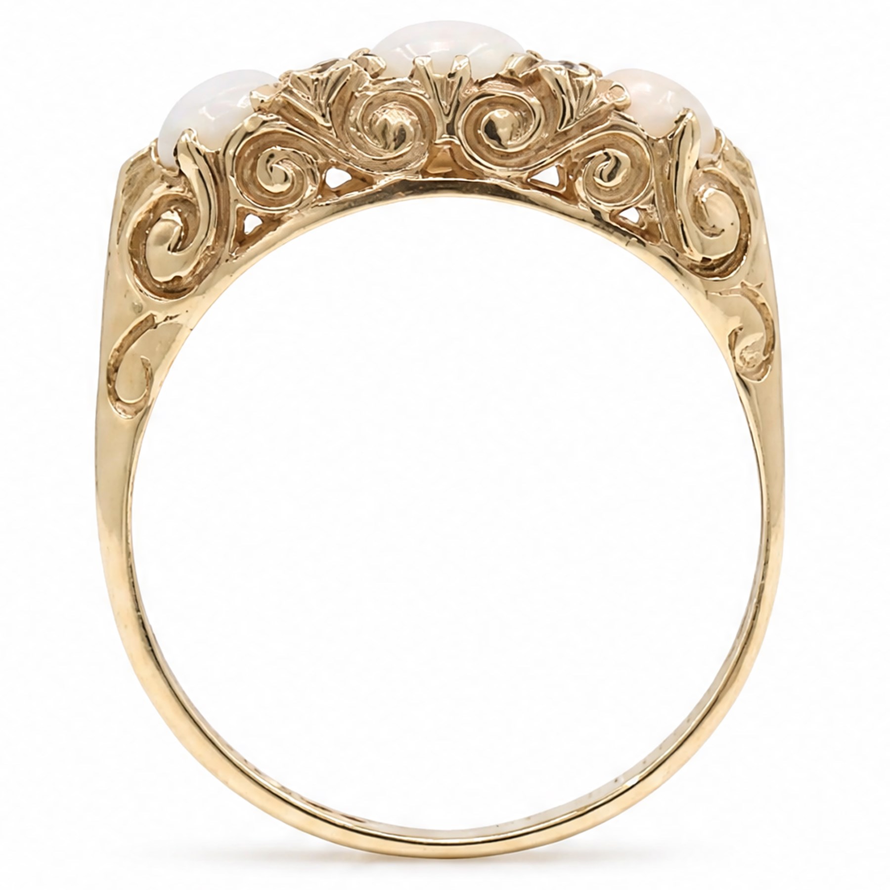 9ct gold three stone opal ring, with four diamond accents set between, Birmingham, 1971