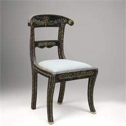 Early 20th century Anglo-Indian painted and inlaid armchairs, each with shaped top rail decorated with polychrome floral motifs above turned spindle galleries, shaped open arms and upholstered seats, on square supports with similar painted decoration