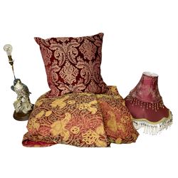 Quilted red and gold bedspread by Sandersons, together with a figural falcon table lamp, red brocade cushion and two red beaded lampshades, bedspread 270cm x 220cm