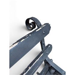 Coalbrookdale - rare pair of wrought iron and slatted wood garden benches, the twin wrought iron strapwork bench-ends formed of four scrolls over splayed feet, number 77 in the Coalbrookdale Castings Catalogue (see illustration)