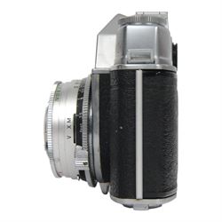 Kodak Retina Reflex camera outfit, comprising camera body serial no. EK 83509, six Schneider-Kreuznach lenses including Retina-Xenon f:2.0/50mm, Retina-Tele-Xenar f:4/135mm, Retina-Curtagon f:4/28mm and Retina-Longar-Xenon f:4/80mm, Retina-Curtar-Xenon f:4/35mm, Retina-Curtar-Xenon f:5.6/35mm, filters, platform and hood, contained within a tan Rowi carry case