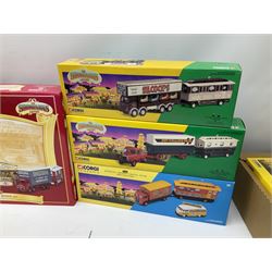 Corgi Showman's Range - thirteen die-cast models comprising 06601, 09901, 12601, 15901, 16101, 16501, 16502, 21701, 24401, 24801, 27602, 27801 and 31012 (Boxing Set); together with Corgi Classics No.31702 ERF Box Van, Showman's Caravan and VW Van; all boxed (14)