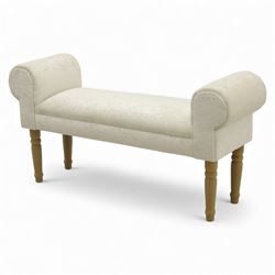 Contemporary upholstered window seat, rectangular padded seat with shallow scroll ends, upholstered in light cream fabric, raised on four turned wooden supports