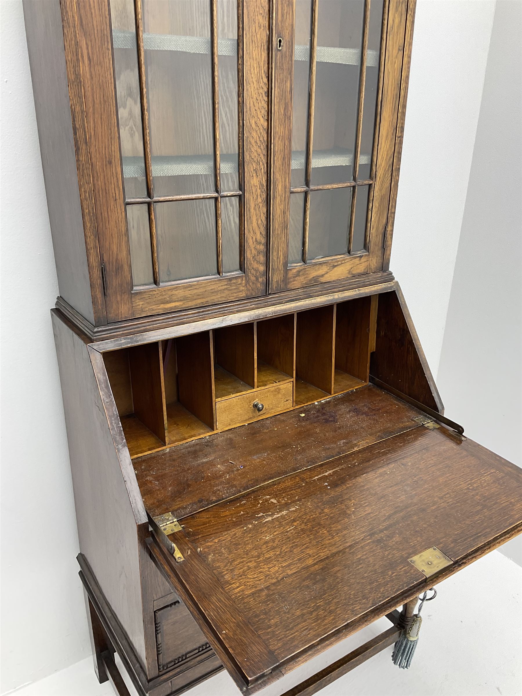 Early 20th century oak bureau bookcase, raised display enclosed