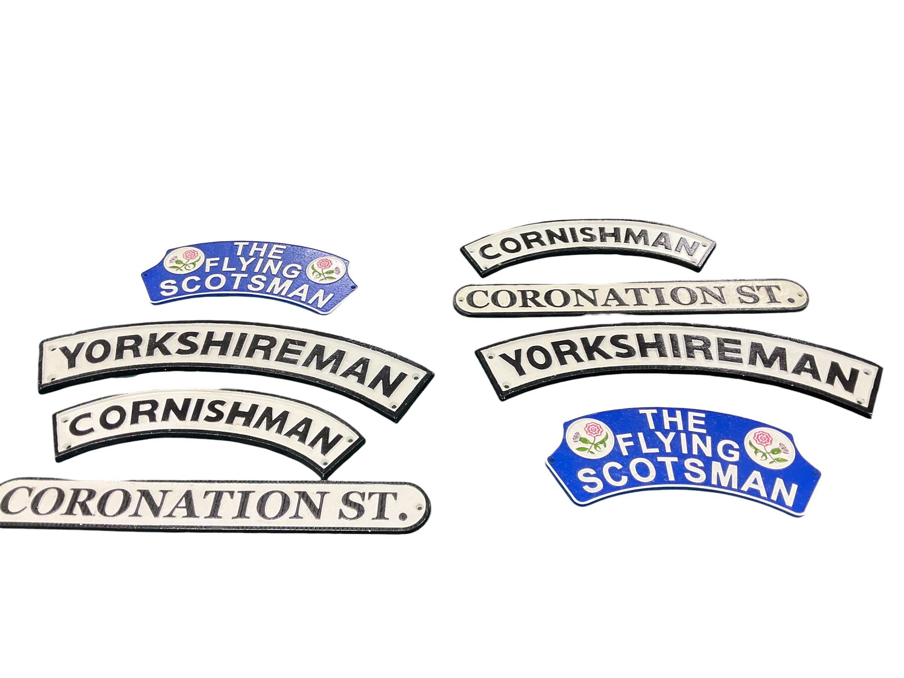 Collection of cast iron signs, including The Flying Scotsman, Yorkshireman, Cornishman etc 