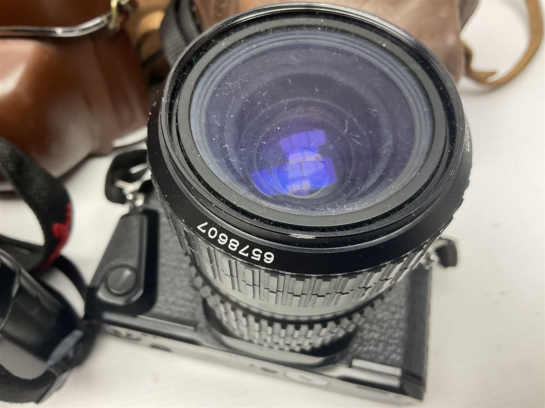 Collection of cameras and lenses, to include Pentax Program A camera body, serial no 123759, with 'Pentax-A zoom 1:3.5-4.5 28-80mm' len, Praktica EE2 camera body with 'Pentacon electric 1.8/50' lens etc, together with a Manfrotto tripod 