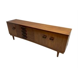 Bath Cabinet Makers BCM - mid-20th century teak sideboard fitted with four drawers and three cupboards with curved handles on tapering supports
