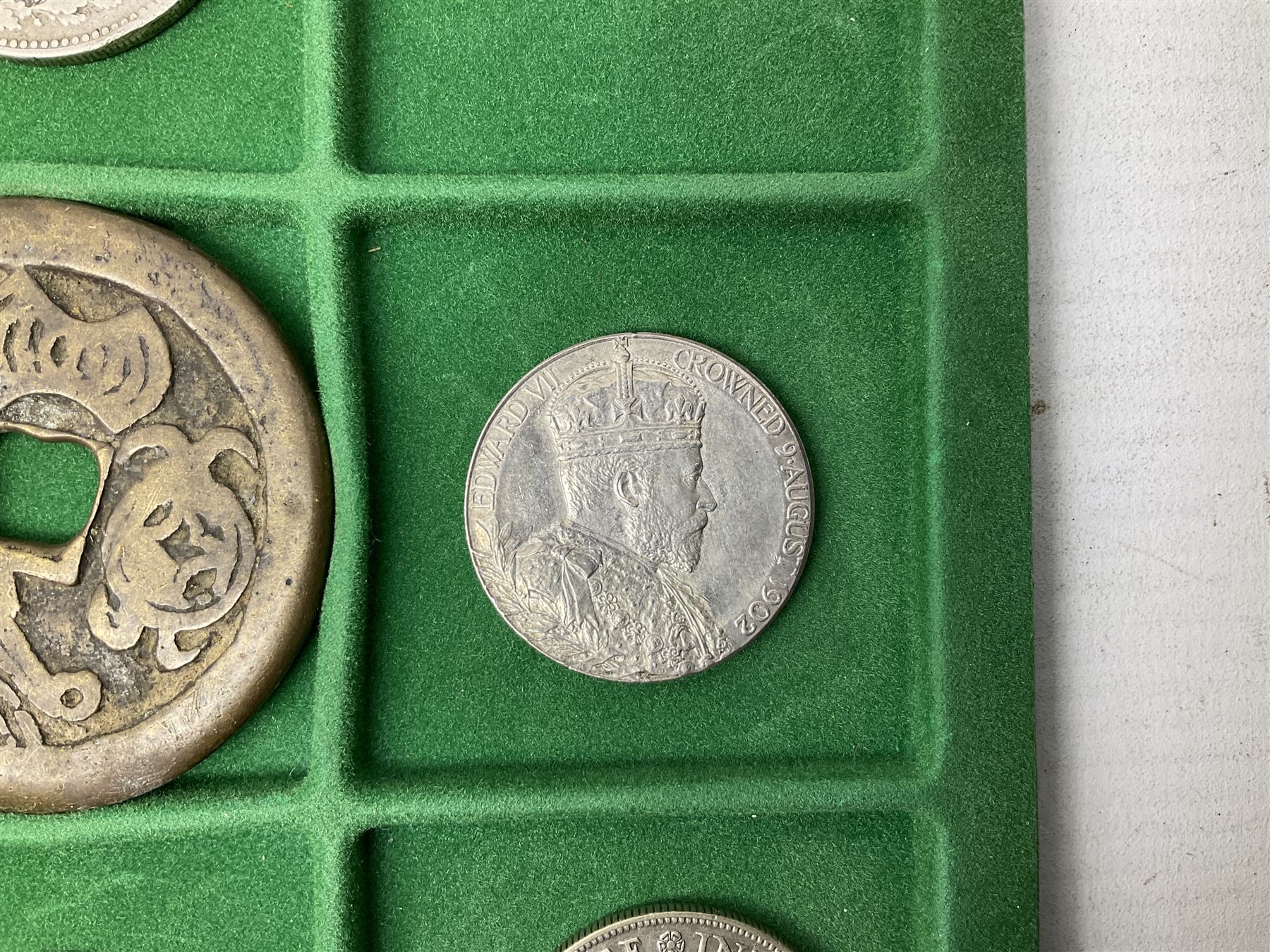 Coins and medallions including, York 1811 one shilling cattle and barber silver token, United States of America 1883O silver Morgan dollar, birds of destiny medal by Malcolm Appleby, Great British King George V 1930 halfcrown, King Edward VII 1902 silver medal, King George V 1916 halfcrown etc, housed in a case with lift out green coin trays