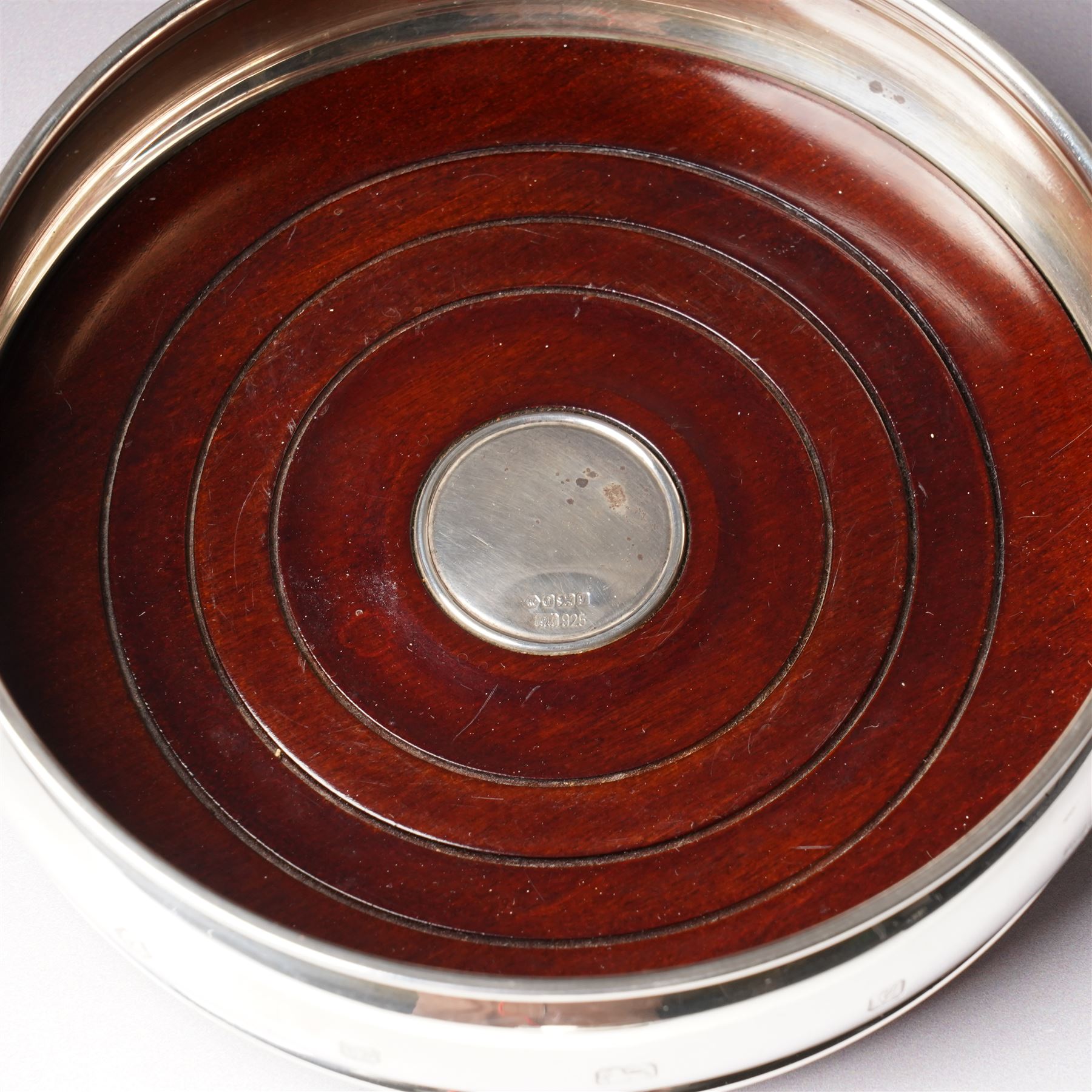 Pair of silver bottle coasters with turned wooden bases D12cm Sheffield 1998 Maker Carr's of Sheffield 
