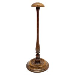 Early 19th century yew wig stand, the domed top upon a tapering baluster and turned stem, and circular base, H30.5cm