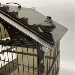 Early 20th century wire bird cage with wooden frame, pitched roof and loop handle, upon four bun feet, H41cm
