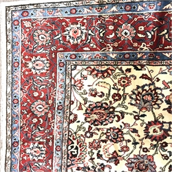 Persian Hamadan red and ivory ground rug, repeating border, central medallion in field of trailing foliage, 363cm x 270cm